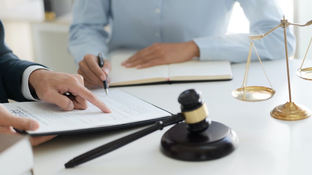 lawyer and client sitting at table